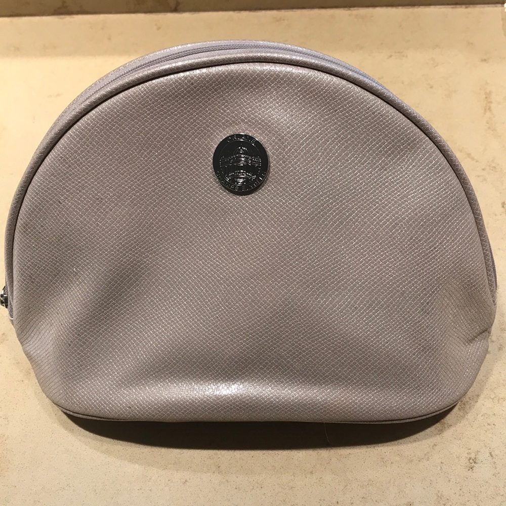 NWOT Orlane Paris taupe shiny cosmetic bag.